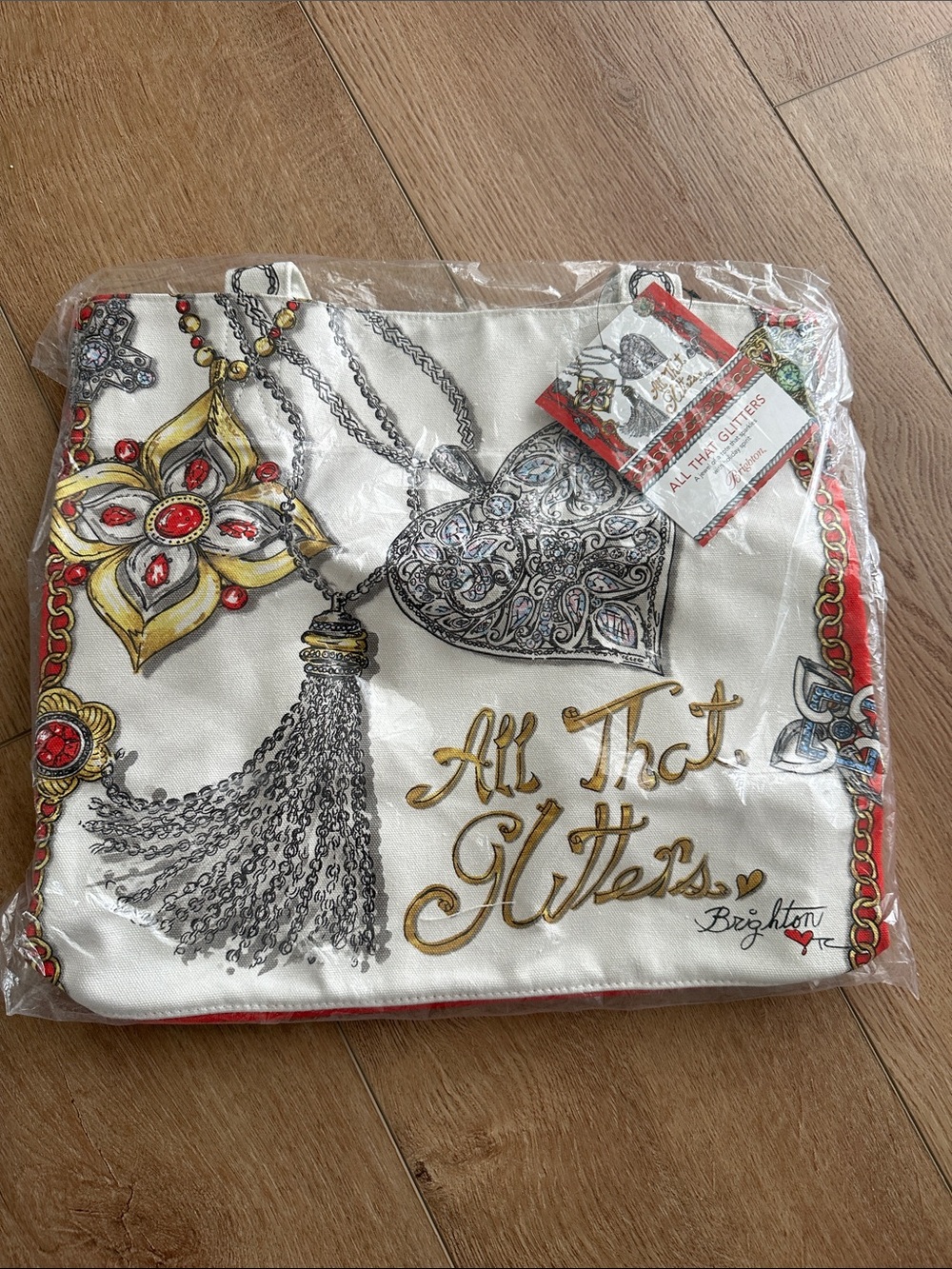 Brighton White Accent Pillow with Gold Script and Red Jewel Motifs